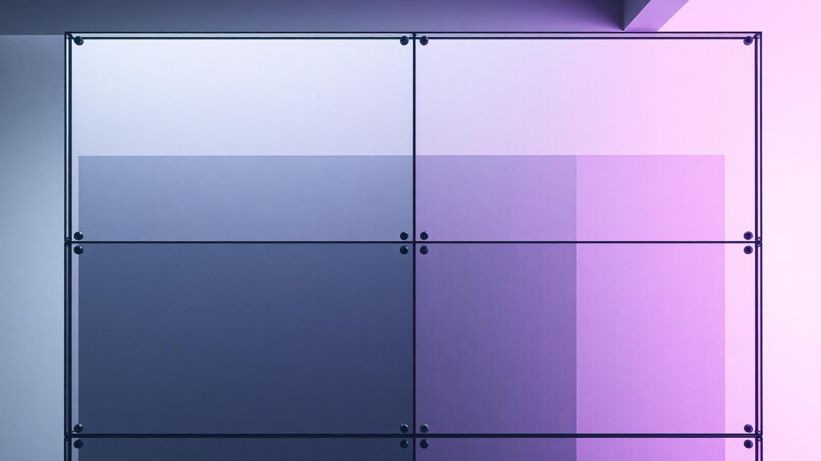 Layered translucent glass panels lit in grey and violet